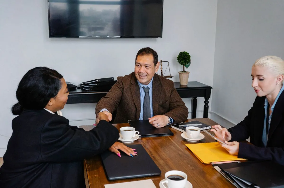 Business professionals discussing an agreement at a meeting