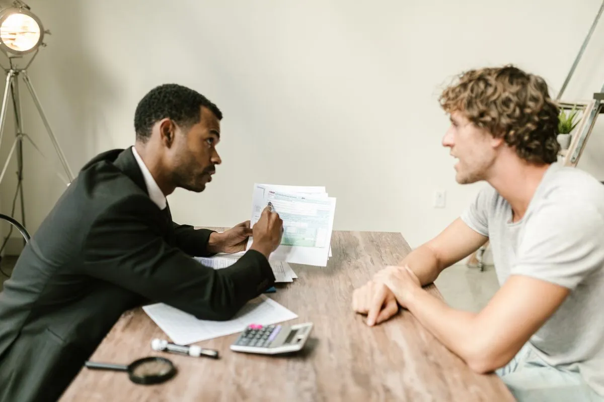 An adviser discussing documents with a client