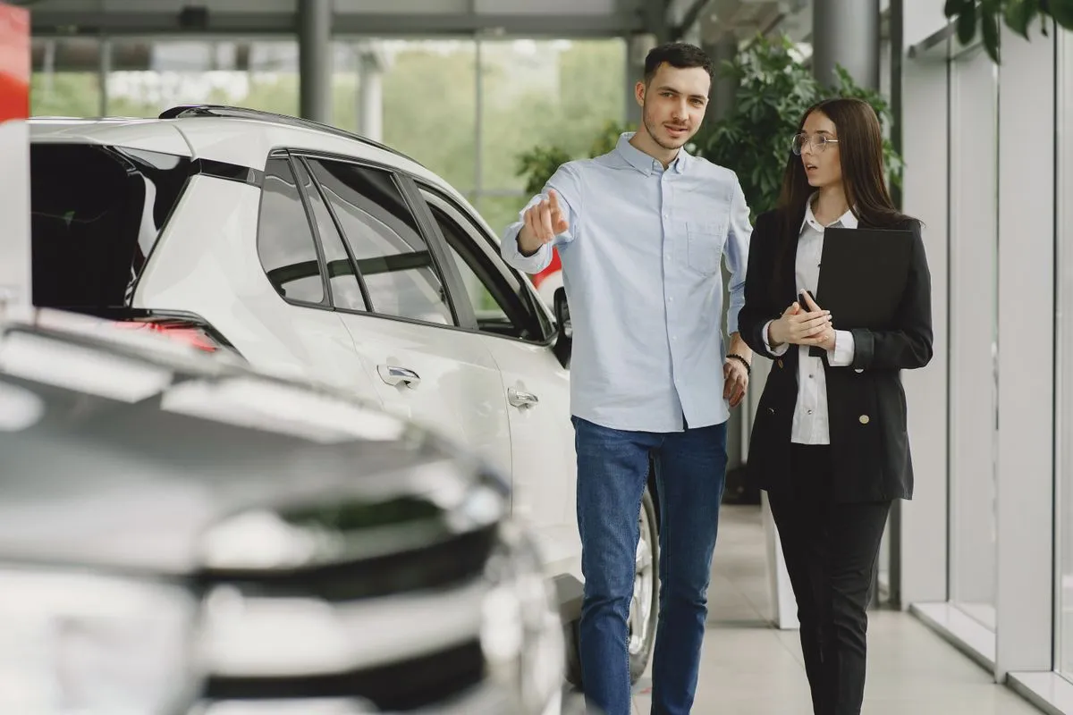 A vehicle consultation inside a car showroom