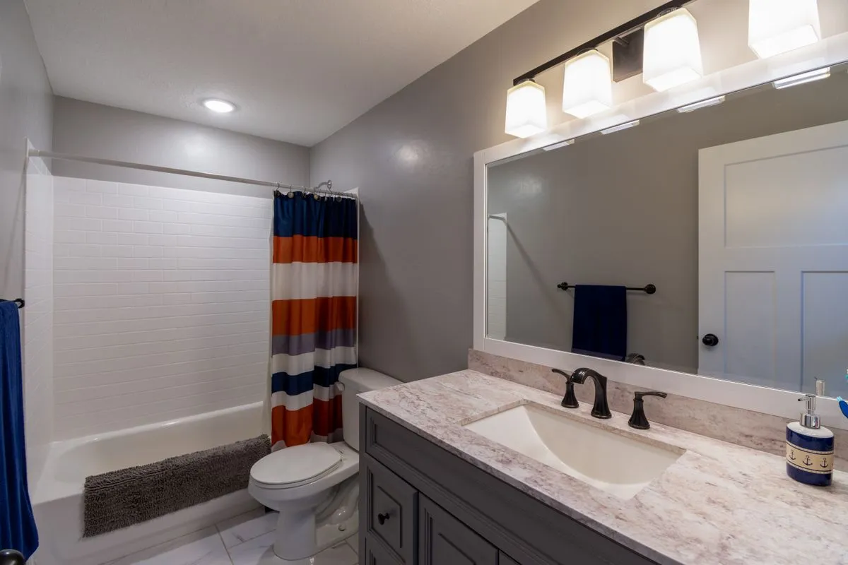 Bright bathroom with a vanity and shower