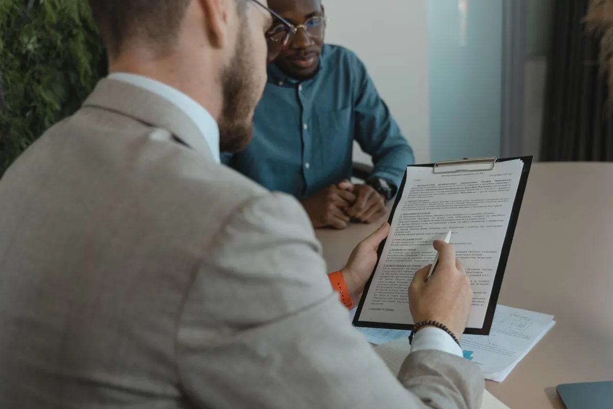 Professionals reviewing an employment document
